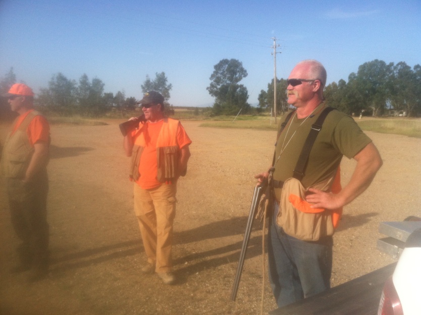 Text Box: Russ, Randy and Randy watching birds being released in the field.